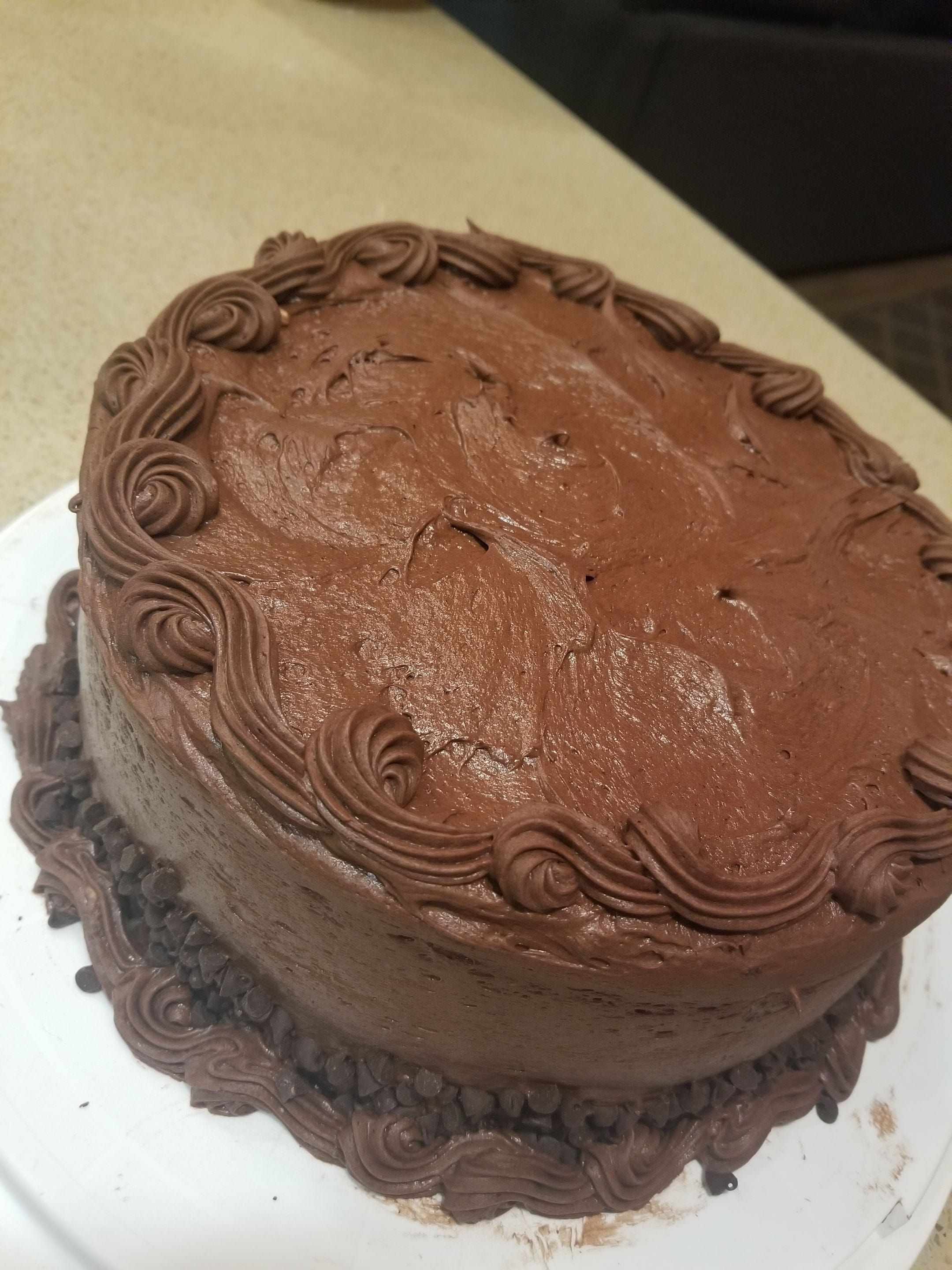 Chocolate cake layered with chocolate cream cheese butterceam frosting